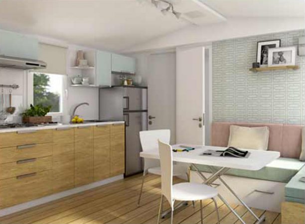 Cucina moderna con tavolo bianco e sedie.